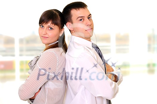 The team of young successful business people in the office workplace. The team of young successful business people in the office workplace.