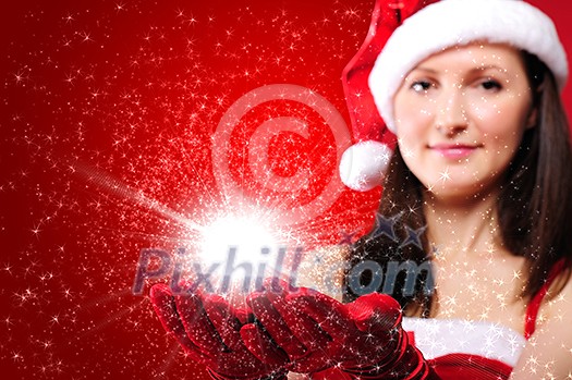 Portrait of a young girl dressed as Santa Claus on a red background. Girl gives gifts. Happy New Year and Merry Christmas! Portrait of a young girl dressed as Santa Claus on a red background. Girl gives gifts. Happy New Year and Merry Christmas!