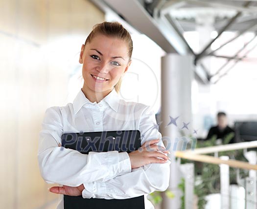portrait of a young pretty woman standing inside office building portrait of a young pretty woman standing inside office building