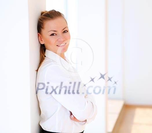 portrait of a young pretty woman standing inside office building portrait of a young pretty woman standing inside office building