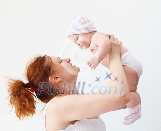 Portrait of a young child and his mother a white background. Baby. Portrait of a young child and his mother a white background. Baby.
