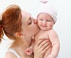Portrait of a young child and his mother a white background. Baby.