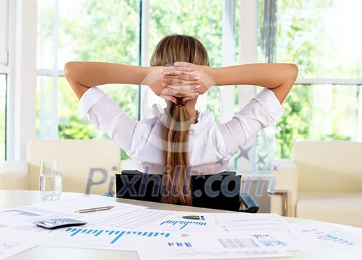 business woman in office working with papers business woman in office working with papers