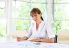 business woman in office working with papers