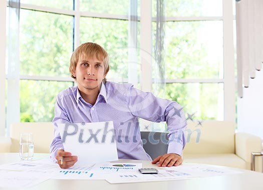 business man in office working with papers business man in office working with papers