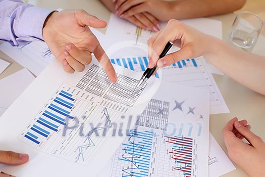 financial and business documents on the table and human hands financial and business documents on the table and human hands