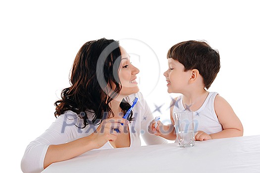 young mother and the little boy brushing teeth young mother and the little boy brushing teeth