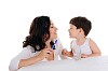 young mother and the little boy brushing teeth