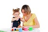 a young mom and her little daughter paint colors in this album