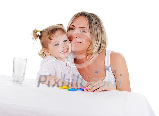young mother and her young daughter hugged and kissed each other on a white background young mother and her young daughter hugged and kissed each other on a white background