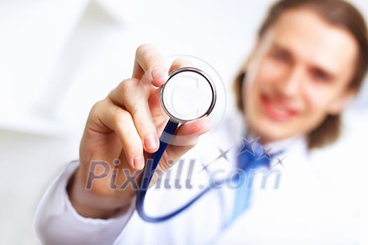 Young confident and friendly doctor in medical office Young confident and friendly doctor in medical office