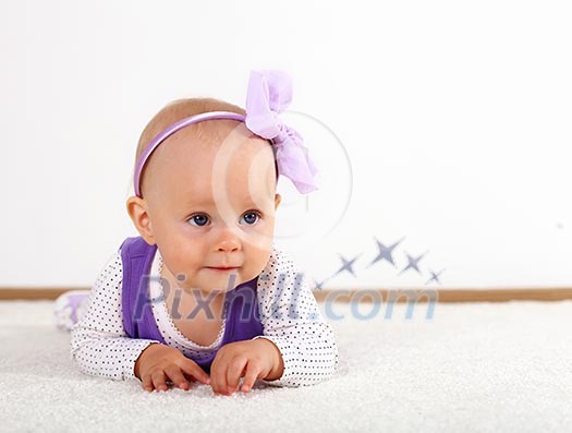 Little daughter crawling in studio Little daughter crawling in studio