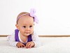 Little daughter crawling in studio