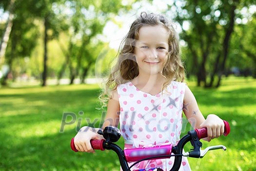 Little happy girl having fun in green summer park Little happy girl having fun in green summer park