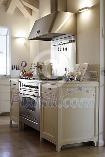 White kitchen block with steel oven and cooker hood White kitchen block with steel oven and cooker hood