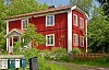 Red house and mailboxes in summer