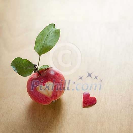 Heart shape cut out of an apple Heart shape cut out of an apple