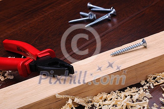 Wood shavings and various construction tools Wood shavings and various construction tools
