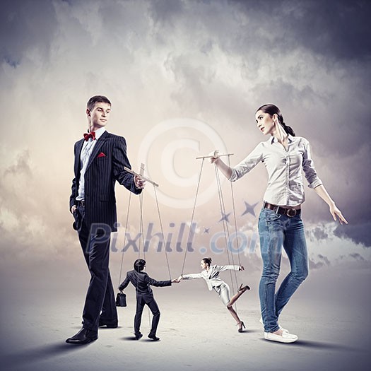 Image of man and woman with marionette puppets Image of man and woman with marionette puppets