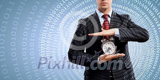 Image of businessman holding alarmclock against illustration background Image of businessman holding alarmclock against illustration background