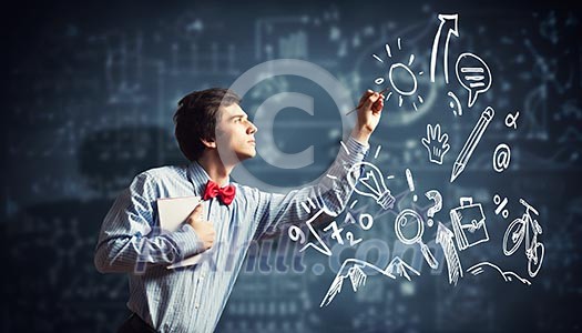 Image of thoughtful male student holding notebook in classroom Image of thoughtful male student holding notebook in classroom