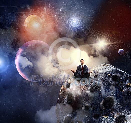 Businessman sitting in lotus flower position against space background Businessman sitting in lotus flower position against space background