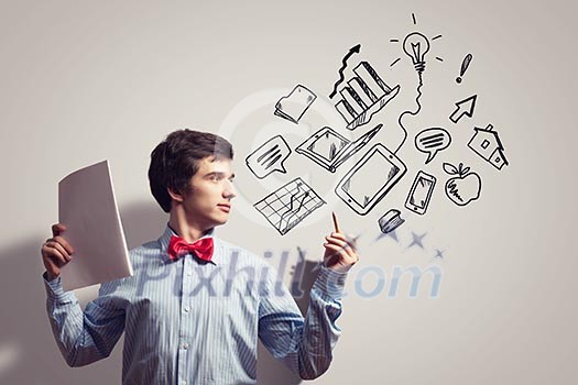 Image of young businessman with notebook drawing collage Image of young businessman with notebook drawing collage