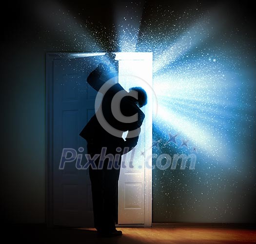 Image of young businessman standing with back opening door Image of young businessman standing with back opening door
