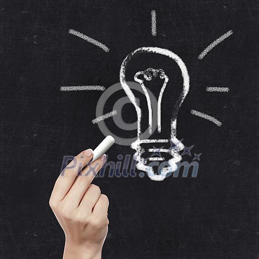 School blackboard and hand with chalk writing on it School blackboard and hand with chalk writing on it