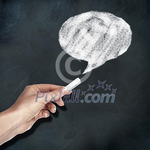 School blackboard and hand with chalk drawing a message symbol School blackboard and hand with chalk drawing a message symbol