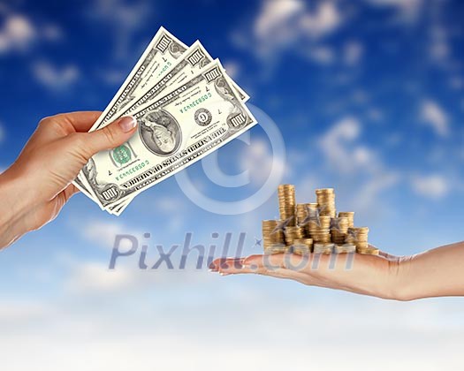 Collage with human hands holding money against blue sky Collage with human hands holding money against blue sky