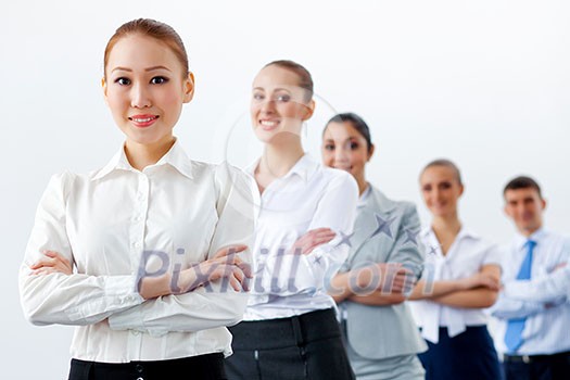 Group of businesspeople smiling standing with arms crossed Group of businesspeople smiling standing with arms crossed