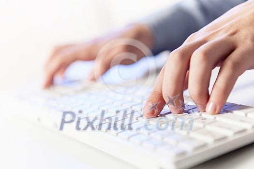 Click! Hands of a man on a keyboard with blue backlighting. Click! Hands of a man on a keyboard with blue backlighting.