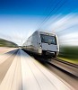 A speeding train leaving a train platform