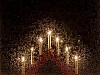 A red electric candlestick in a frosty window