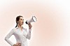 Image of young businesswoman screaming in megaphone