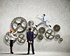 Businessman and businesswoman with cog wheel elements. Organization concept