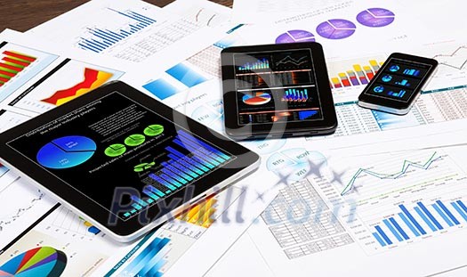Image of working place with mobile phone, ipad and tablet PC Image of working place with mobile phone, ipad and tablet PC
