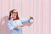 Young woman with an old-fashioned alarm clock