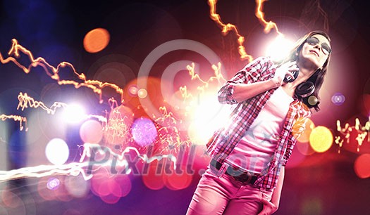 Young girl listens to music. Modulations of color and light. Young girl listens to music. Modulations of color and light.