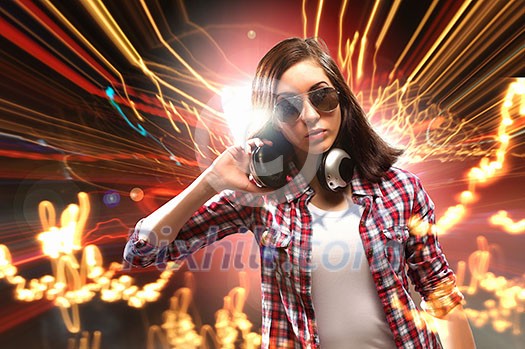 Young girl listens to music. Modulations of color and light. Young girl listens to music. Modulations of color and light.