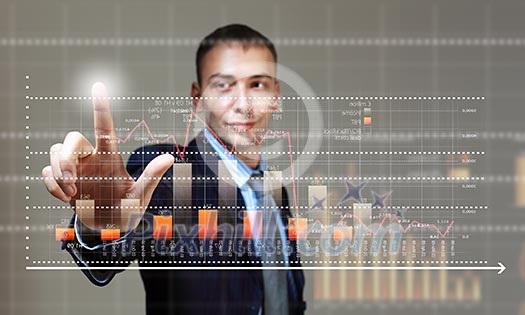 Young businessman touching icon of media screen with diagrams and graphs Young businessman touching icon of media screen with diagrams and graphs