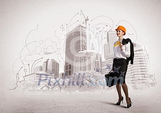 Image of woman engineer in helmet with drafts. Construction concept Image of woman engineer in helmet with drafts. Construction concept