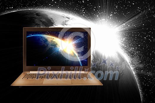 Notebook with our planet earth against black background with globe Notebook with our planet earth against black background with globe