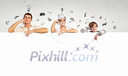 Happy young family with blank banner. Place for text Happy young family with blank banner. Place for text