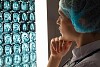 Image of attractive woman doctor looking at x-ray results