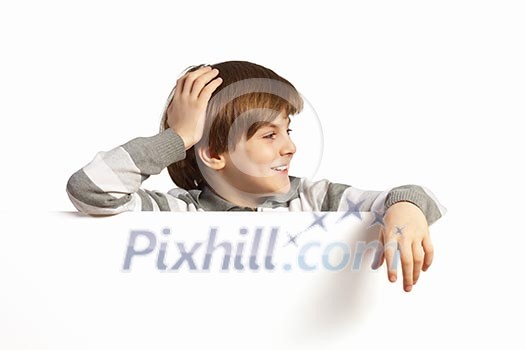 Little boy holding a blank white billboard Little boy holding a blank white billboard
