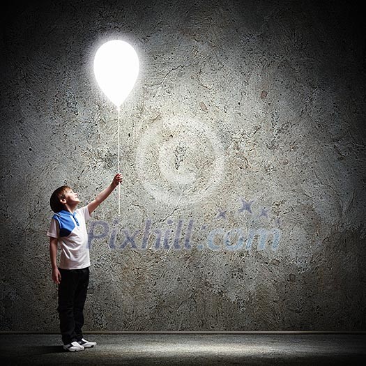 Image of little cute boy playing with balloon Image of little cute boy playing with balloon