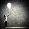 Image of little cute boy playing with balloon