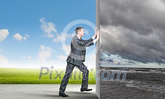 Image of young business man changing reality Image of young business man changing reality